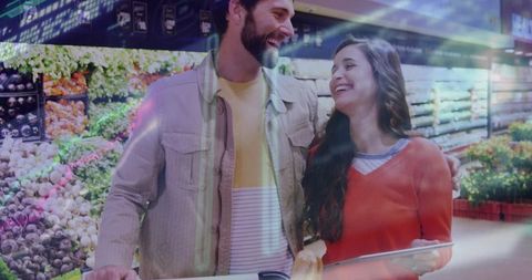 Smiling couple shopping fresh produce together, sharing cart, casual grocery lifestyle