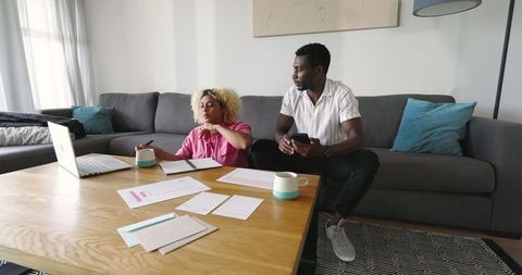 Friends collaborating and overcoming challenges in home environment