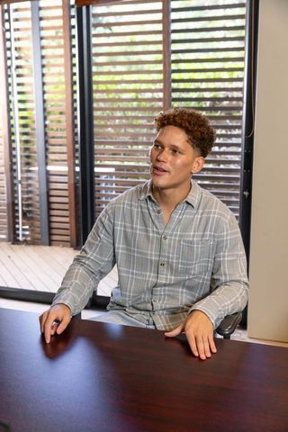 Young professional discussing ideas in modern office space