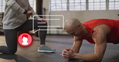 Man performing forearm plank while trainer coaching with smartwatch ui overlay