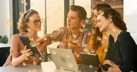 Coworkers Discussing Bitcoin Investment Opportunities in Modern Office