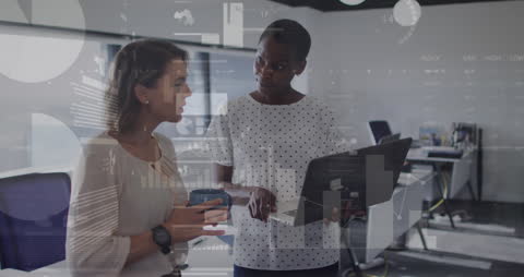 Diverse Business Professionals Analyzing Digital Data in Office