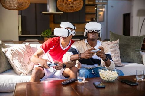 Diverse Friends Enjoy Virtual Reality Gaming at Home