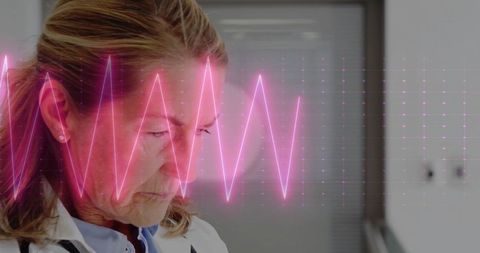 Doctor analyzing ecg data with advanced technology interface