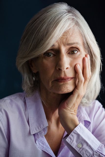 Sad Senior Woman Portrait with Hand on Face - Download Free Stock Photos Pikwizard.com