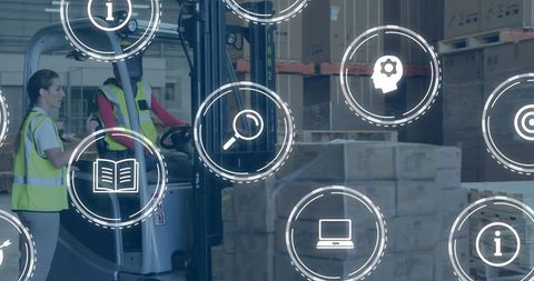 Warehouse Workers Using Technology in Logistics Operations