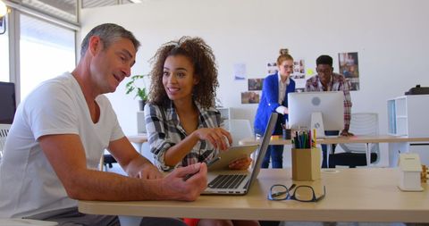 Diverse team collaborating in contemporary office environment