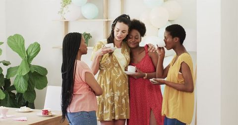 Diverse Women Bonding Over Tea at Home Social Gathering
