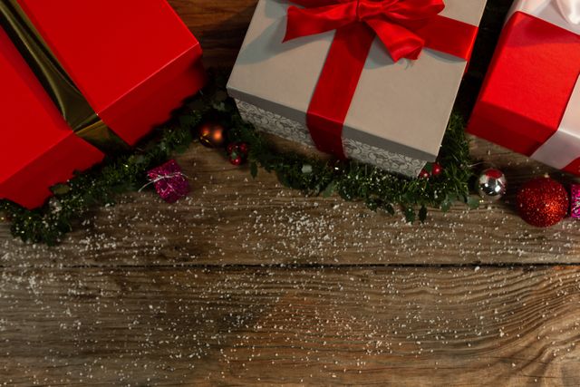 Christmas gifts on a wooden table with ornament