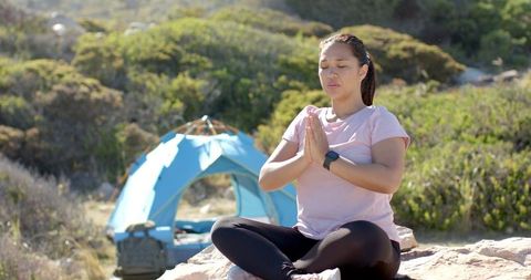 Woman Practicing Meditation Near Camping Setup in Mountains - Download Free Stock Images Pikwizard.com