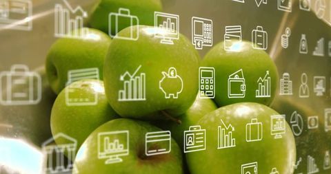 Green Apples with Finance Icon Overlay for Business, Finance and Healthy Lifestyle Concept