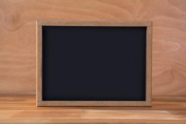 Close-up of blank chalkboard on a table
