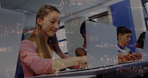 Schoolchildren Engaged with Laptops Learning Mathematics