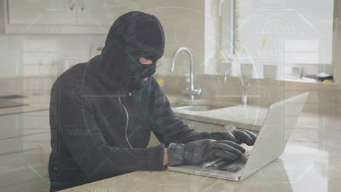 Hacker in Mask Accessing Laptop with Virtual Covid-19 Data