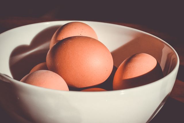 Fresh Brown Eggs in White Bowl on Sunlit Table - Download Free Stock Photos Pikwizard.com