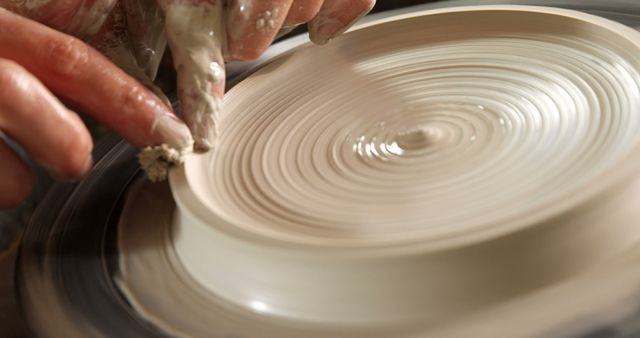 Close-Up of Potter Shaping a Ceramic Plate on Pottery Wheel - Download Free Stock Images Pikwizard.com
