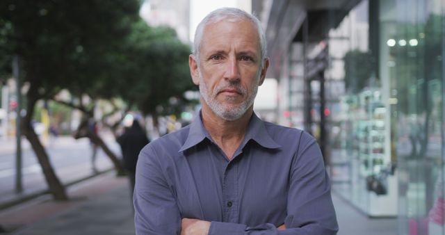 Confident Elderly Man Standing Outdoors on City Street - Download Free Stock Images Pikwizard.com