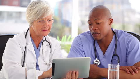 Medical Professionals Collaborating in Modern Office