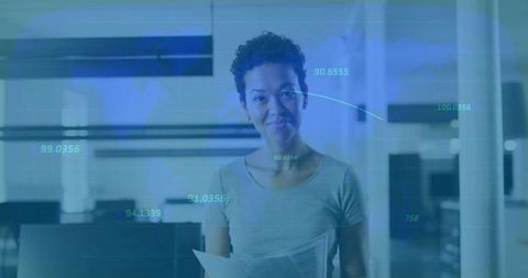 Office Analyst Examining Data with Futuristic Digital Overlays