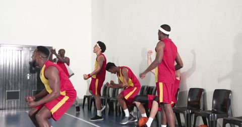 Diverse Basketball Team Celebrating Victory on Court