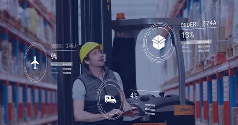 Man working in warehouse with overlay data icons