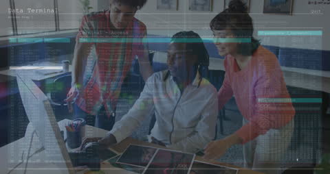 Diverse Business Team Analyzing Digital Data on Laptop