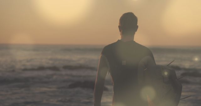 Surfer Ready to Catch Waves at Sunset Beach - Download Free Stock Images Pikwizard.com