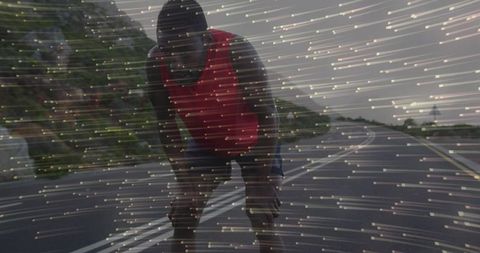 Runner bending forward on coastal highway with dynamic light streak overlay conveying endurance