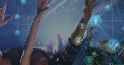 Fans raising hands at neon concert with digital network overlay