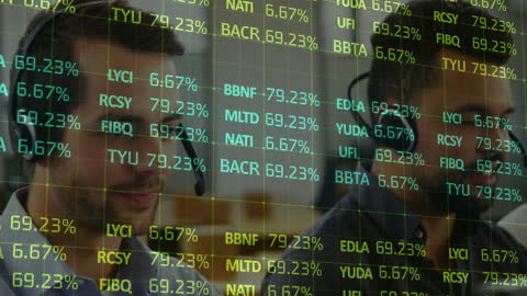 Financial Analysts Reviewing Data on Multiple Screens