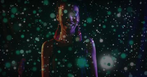 Stage performer in spotlight with dramatic light effect