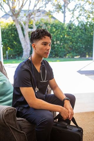 Young Asian Male Healthcare Professional Relaxing at Home