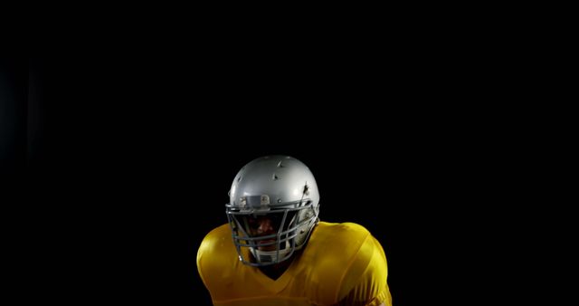 Football Player in Yellow Jersey Against Black Background - Download Free Stock Images Pikwizard.com