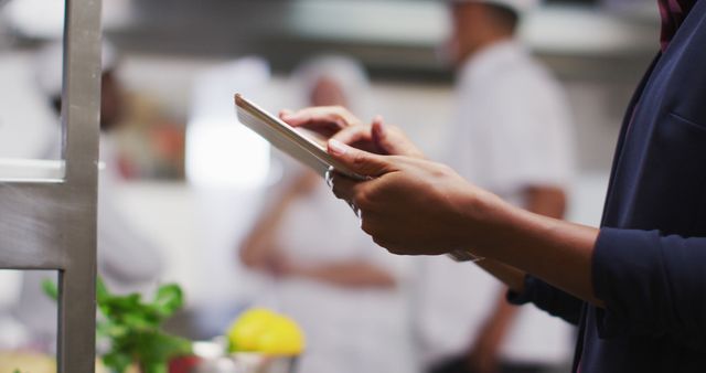 Chef Checking Recipes on Digital Tablet in Professional Kitchen - Download Free Stock Images Pikwizard.com