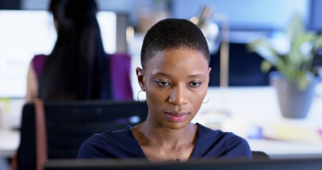 Portrait of african american businesswoman using computer in office, copy space - Download Free Stock Photos Pikwizard.com