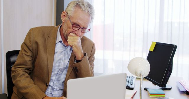 Senior Businessman Deep in Thought at Office Desk - Download Free Stock Images Pikwizard.com