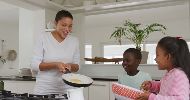 Mom Making Pancakes with Kids in Modern Kitchen - Download Free Stock Images Pikwizard.com