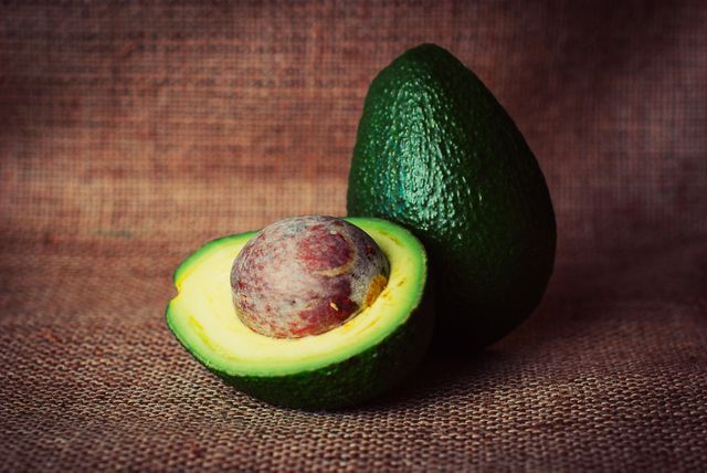 Fresh Cut Avocado with Seed on Burlap Cloth - Download Free Stock Photos Pikwizard.com