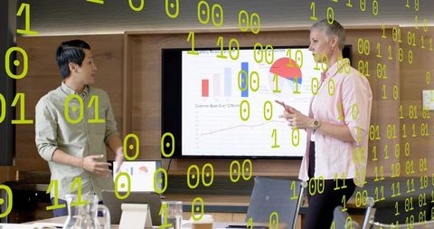 Team Presenting Data Charts and Discussing Analytics Insights in Modern Conference Room