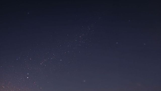 Diagonal Milky Way Band Stretching Across Clear Night Sky with Bright Stars