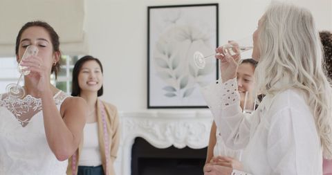 Bride Celebrating with Friends in Bridal Suite