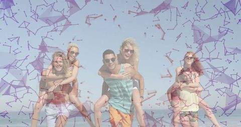 Cheerful Friends Enjoying Beach Piggyback Fun in Vibrant Swimwear