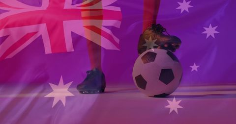 Soccer player holding ball with australian flag overlay