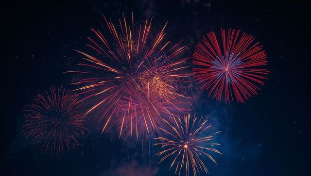 Vibrant Fireworks Bursting Across Night Sky