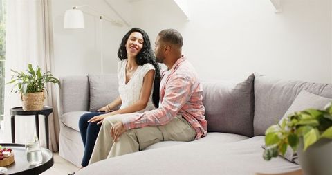 Couple Enjoying Quality Time Taking Selfie on Modern Couch