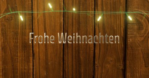 Frohe Weihnachten Text with Fairy Lights on Wooden Background - Download Free Stock Images Pikwizard.com