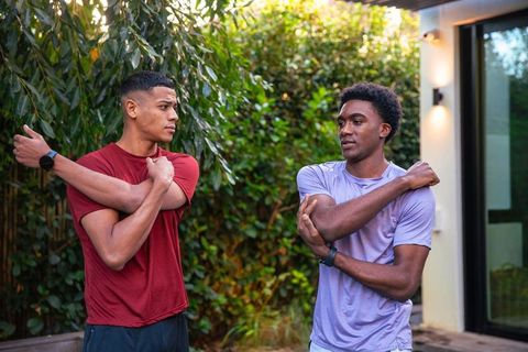 Diverse Friends Stretching Together Outdoors