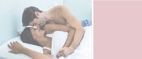 Romantic couple enjoying tender moment in bed