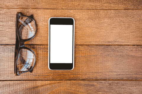 Transparent Glasses and Smartphone on Rustic Wood Desk - Download Free Stock Videos Pikwizard.com