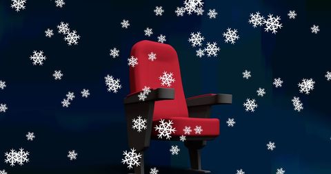 Red cinema seat with falling snowflakes